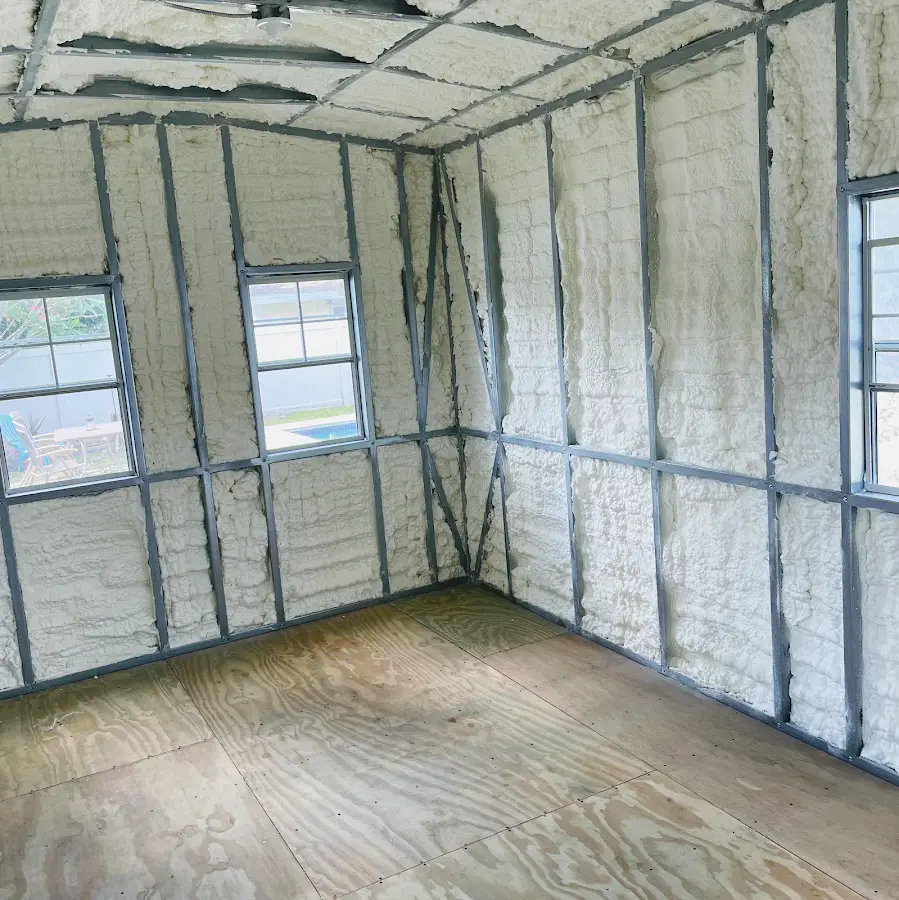 Closed-cell spray foam insulation applied to wall cavities in a residential project in Douglas